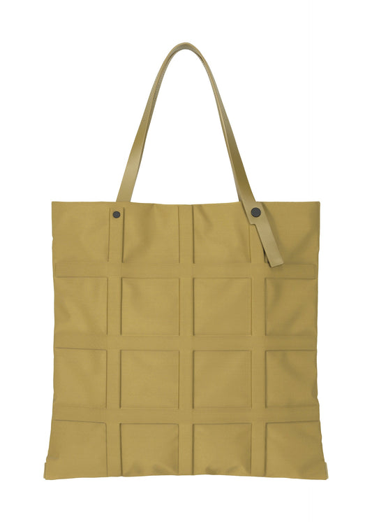 A product shot of the GOOD GOODS ISSEY MIYAKE GRID bag in dark yellow (53).