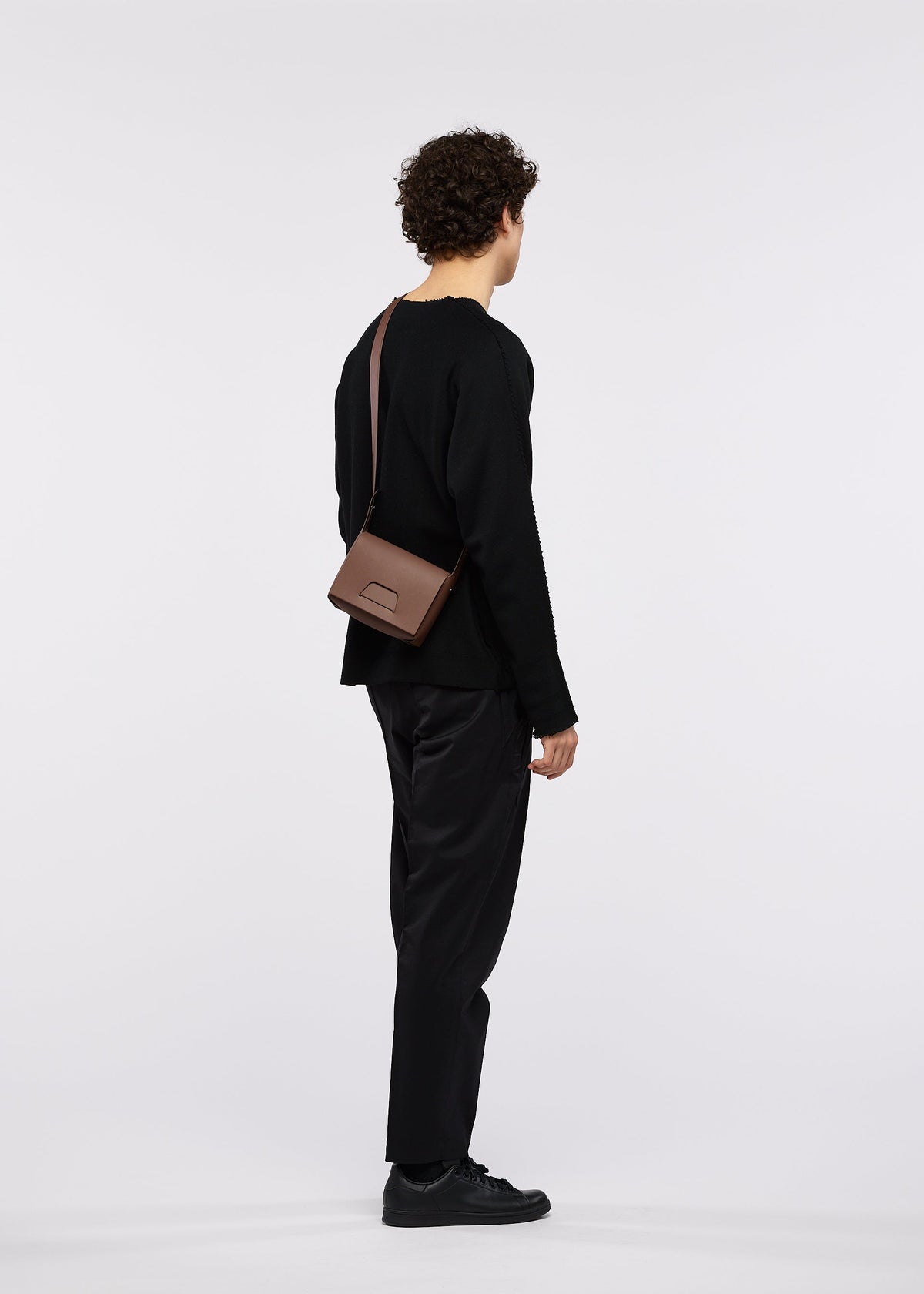 A model wears the GOOD GOODS ISSEY MIYAKE BOX box-handbag-silver.