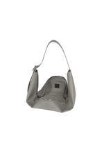 A detail shot of the GOOD GOODS ISSEY MIYAKE LEAF handbag.