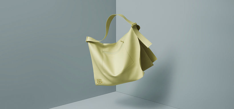 Centre: ROLL Bag in Light Green, suspended mid-air against a grey background.