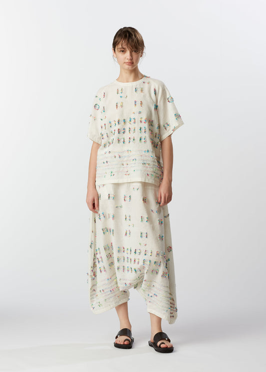 A model wears the HAAT KOMOREBI trousers.