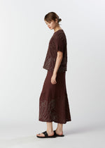A model wears the HAAT KYO CHIJIMI HOTARU skirt.
