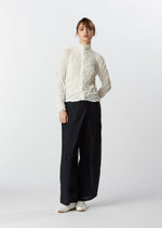 A model wears the HAAT KUMO SHIBORI SUCKER shirt.