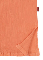 A detail shot of the HAAT KYO CHIJIMI MAY shirt.