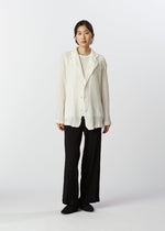 A model wears the HAAT KYO CHIJIMI 2WAY cardigan.