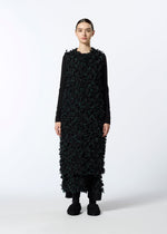 A model wears the HAAT RIBBON TWEED clothing.