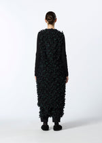 A model wears the HAAT RIBBON TWEED clothing.