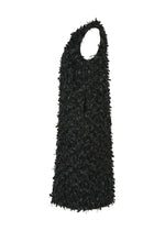 A detail shot of the HAAT RIBBON TWEED clothing.