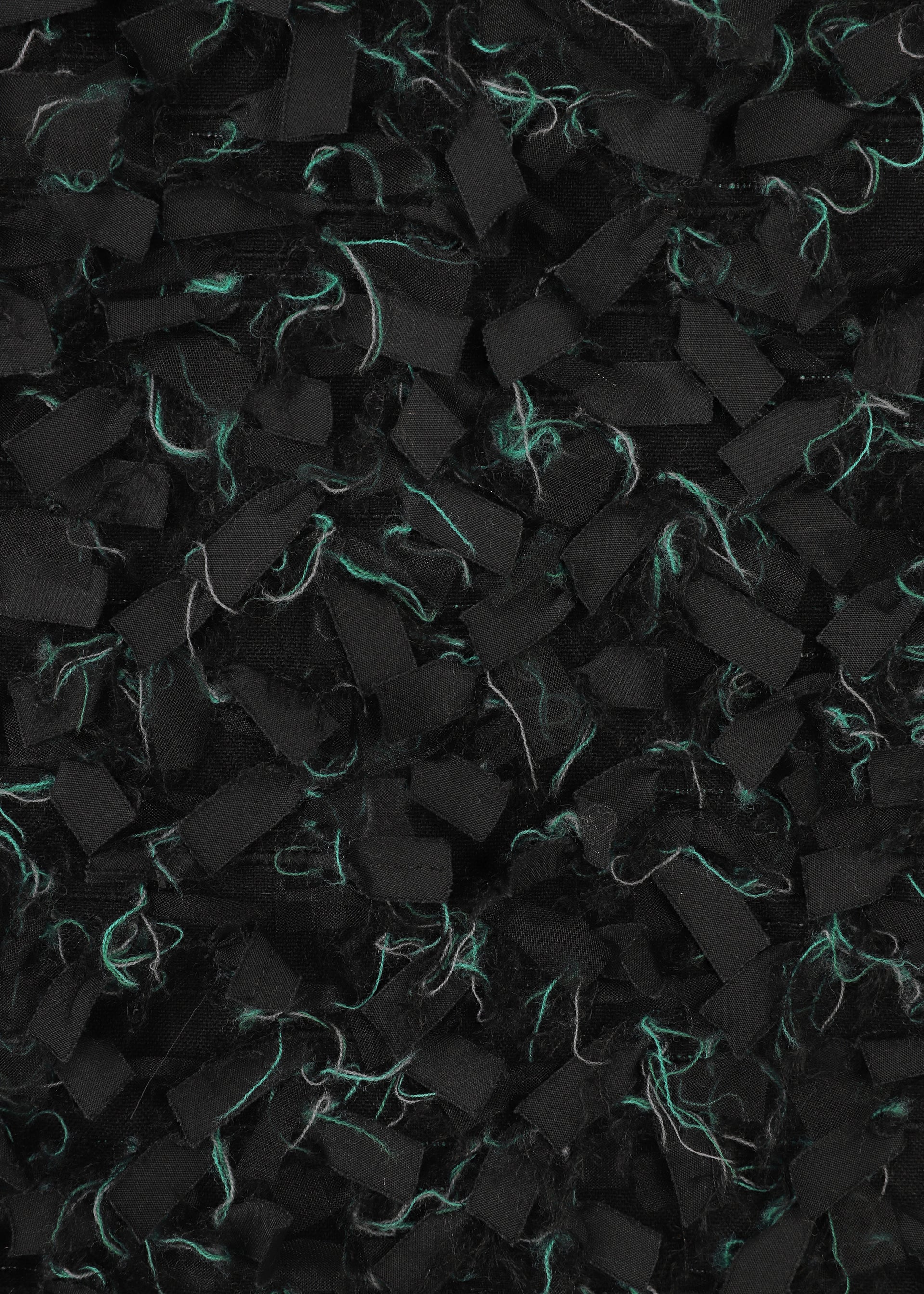 A detail shot of the HAAT RIBBON TWEED clothing.