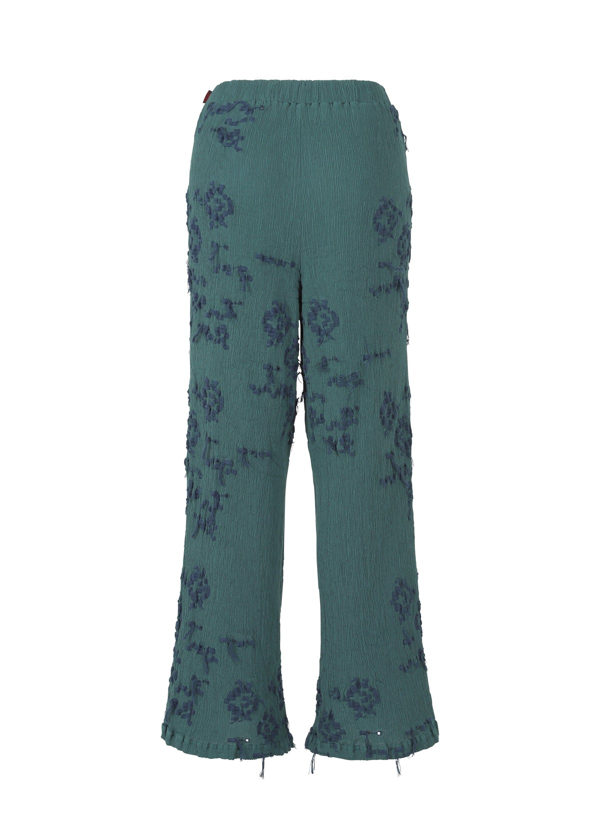 A detail shot of the HAAT KYO CHIJIMI CUT LOOP trousers.