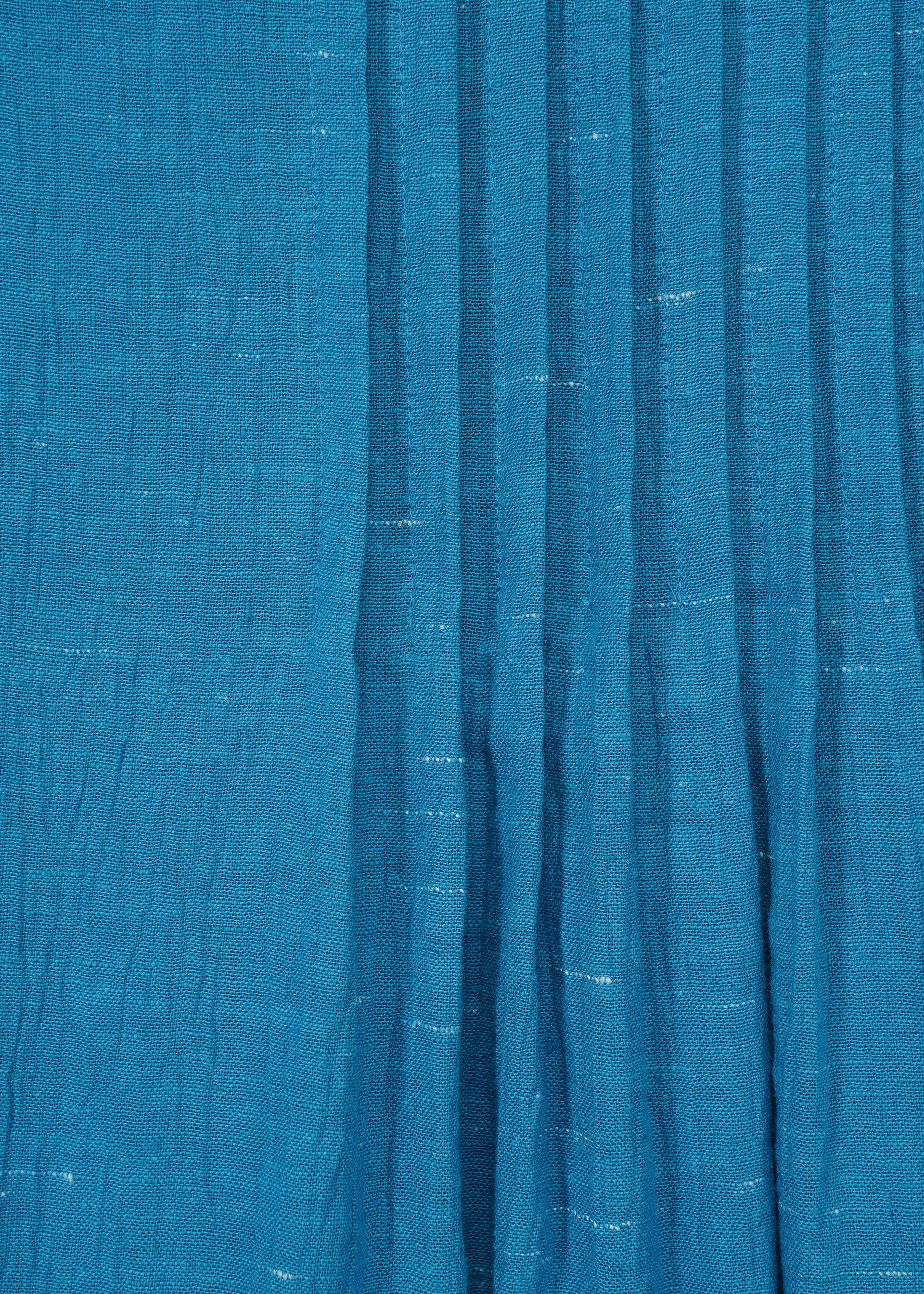 A detail shot of the HAAT PINTUCKING trousers.