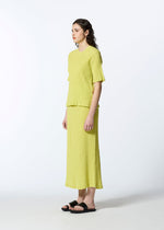 A model wears the HAAT KYO CHIJIMI AUGUST skirt.