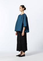 A model wears the HAAT TATSUMAKI SKIRT skirt.