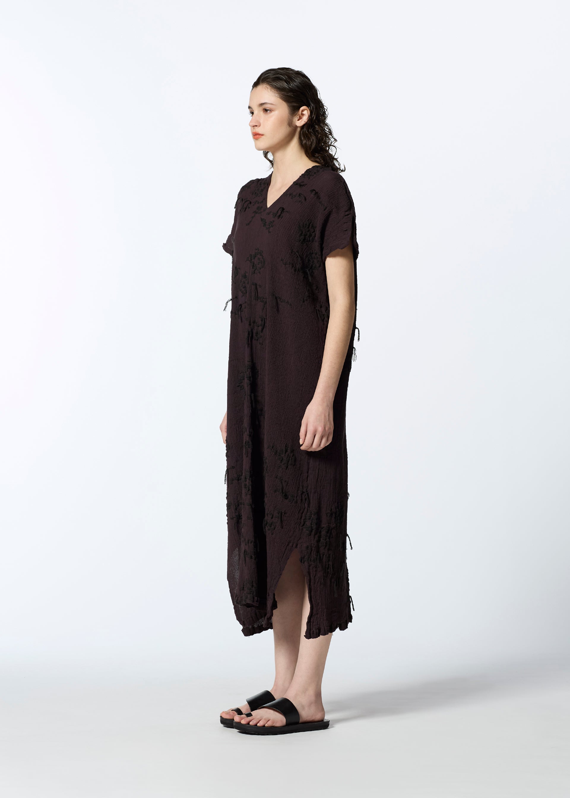 A model wears the HAAT KYO CHIJIMI CUT LOOP dress.