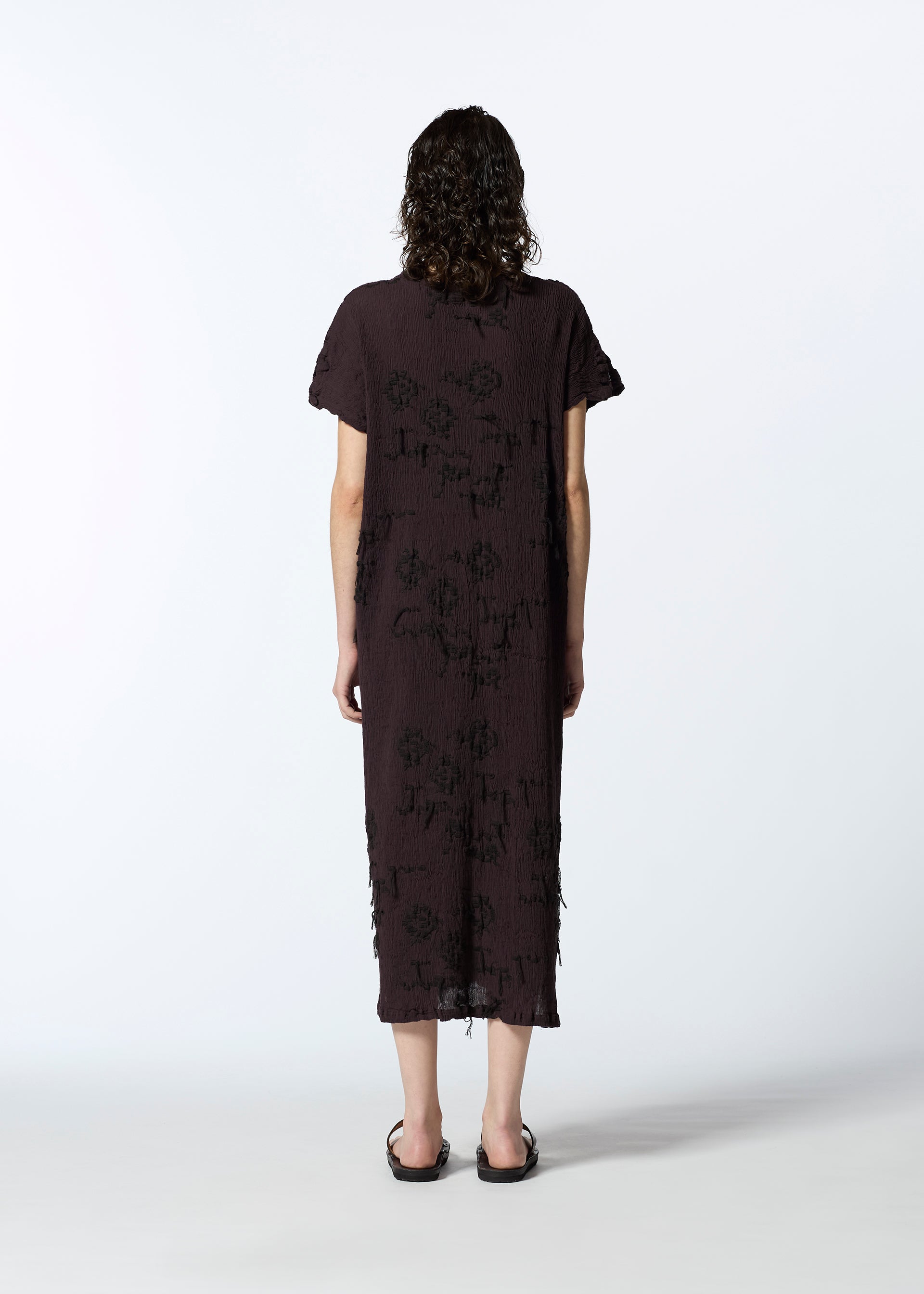 A model wears the HAAT KYO CHIJIMI CUT LOOP dress.