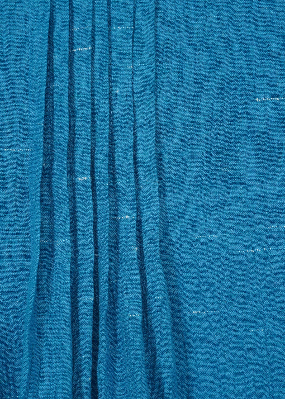 A detail shot of the HAAT PINTUCKING dress.