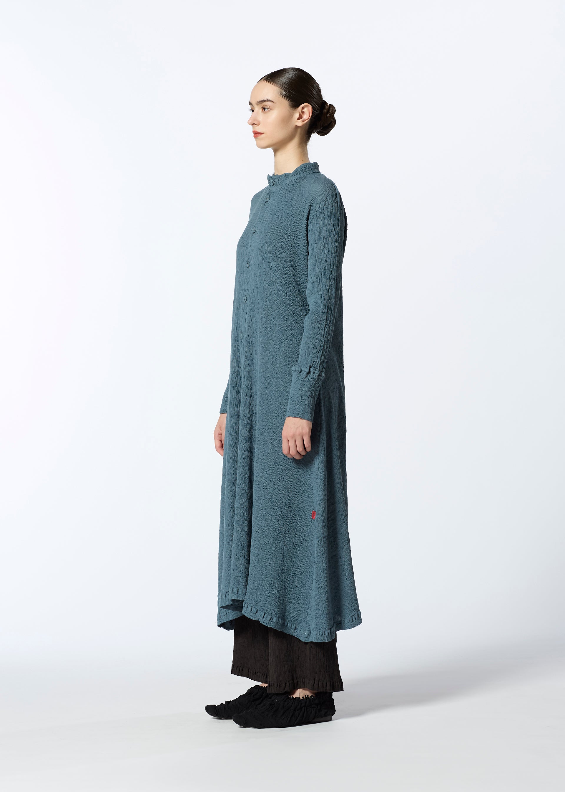 A model wears the HAAT KYO CHIJIMI SEPTEMBER dress.