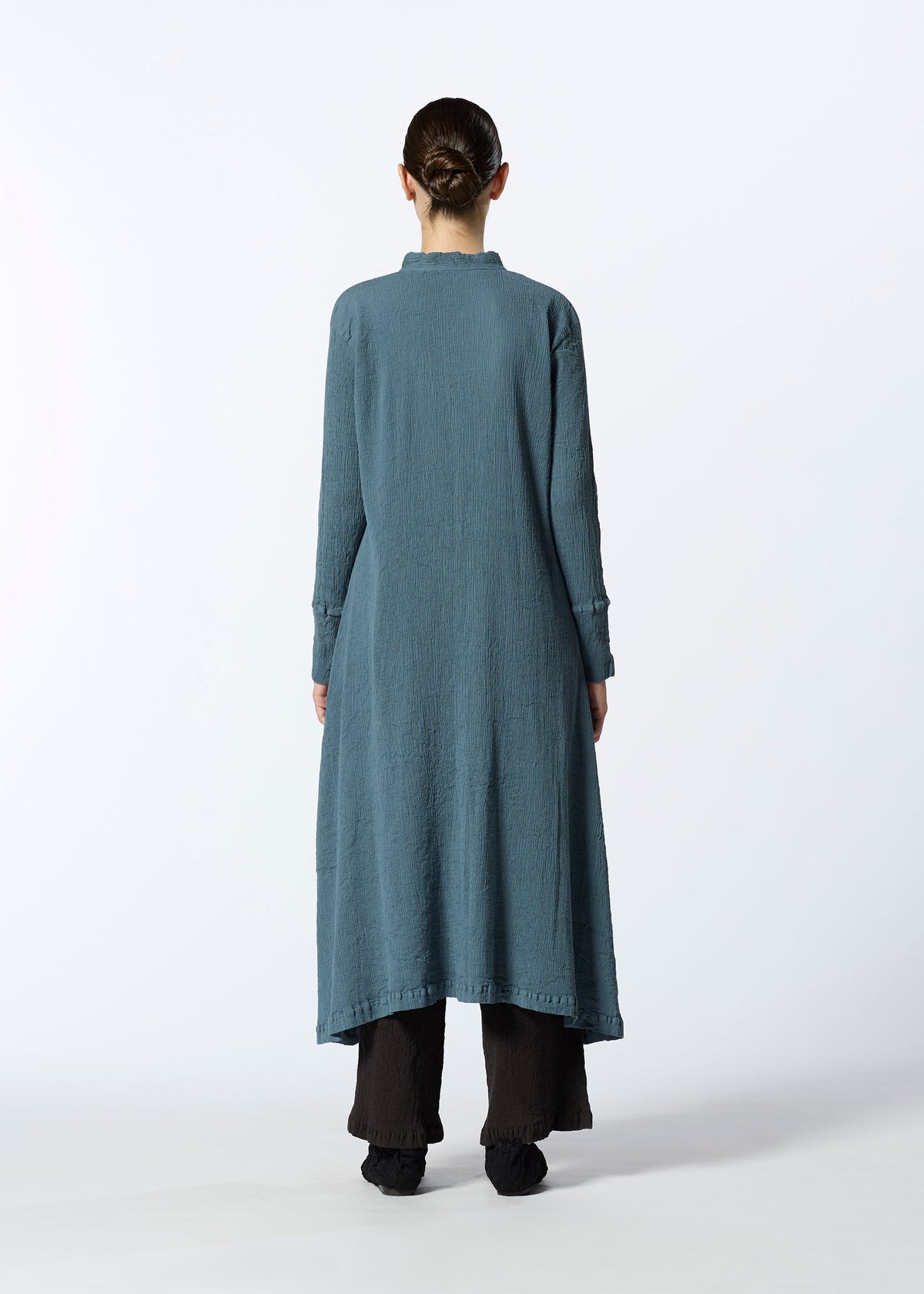 A model wears the HAAT KYO CHIJIMI SEPTEMBER dress.