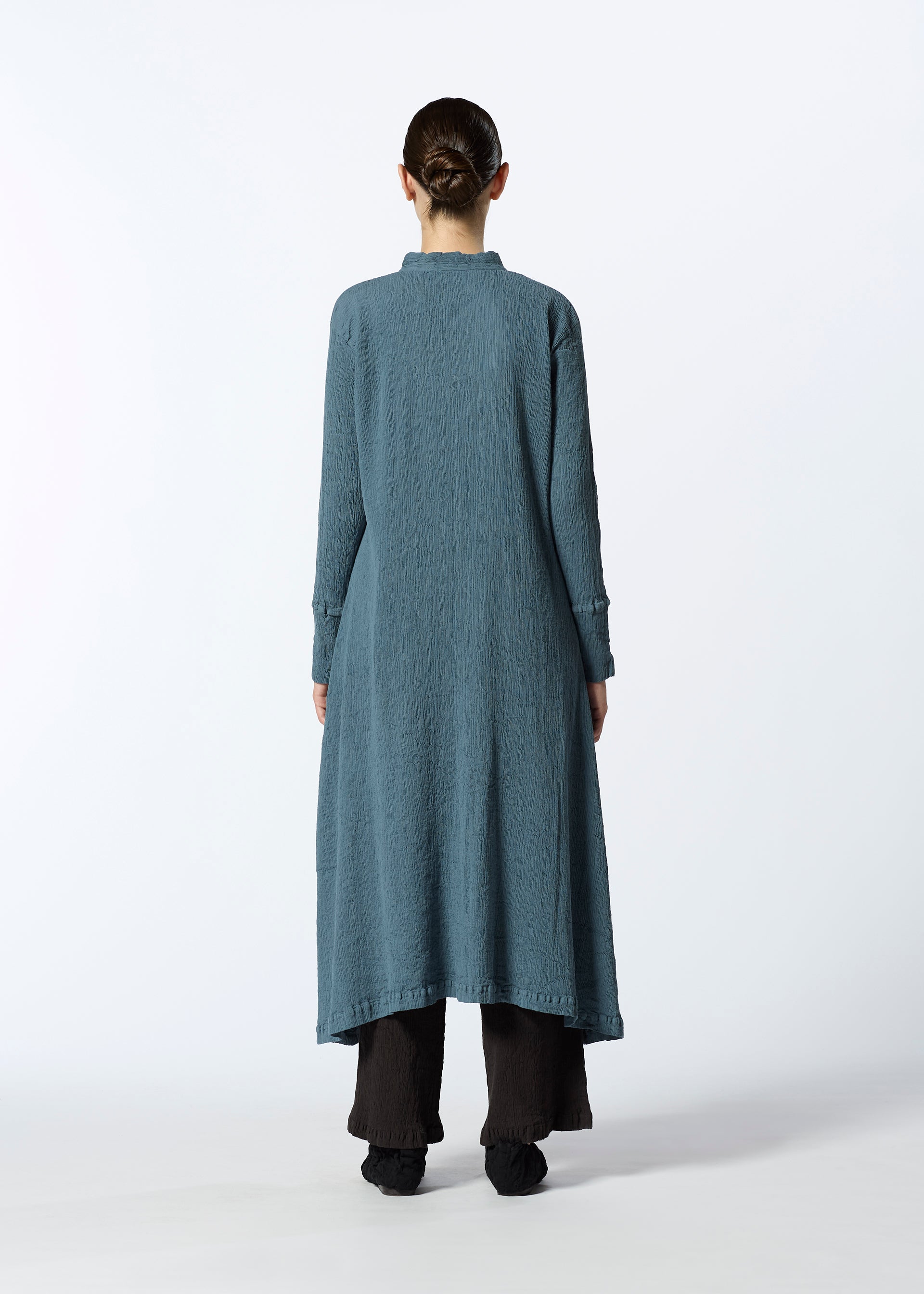 A model wears the HAAT KYO CHIJIMI SEPTEMBER dress.