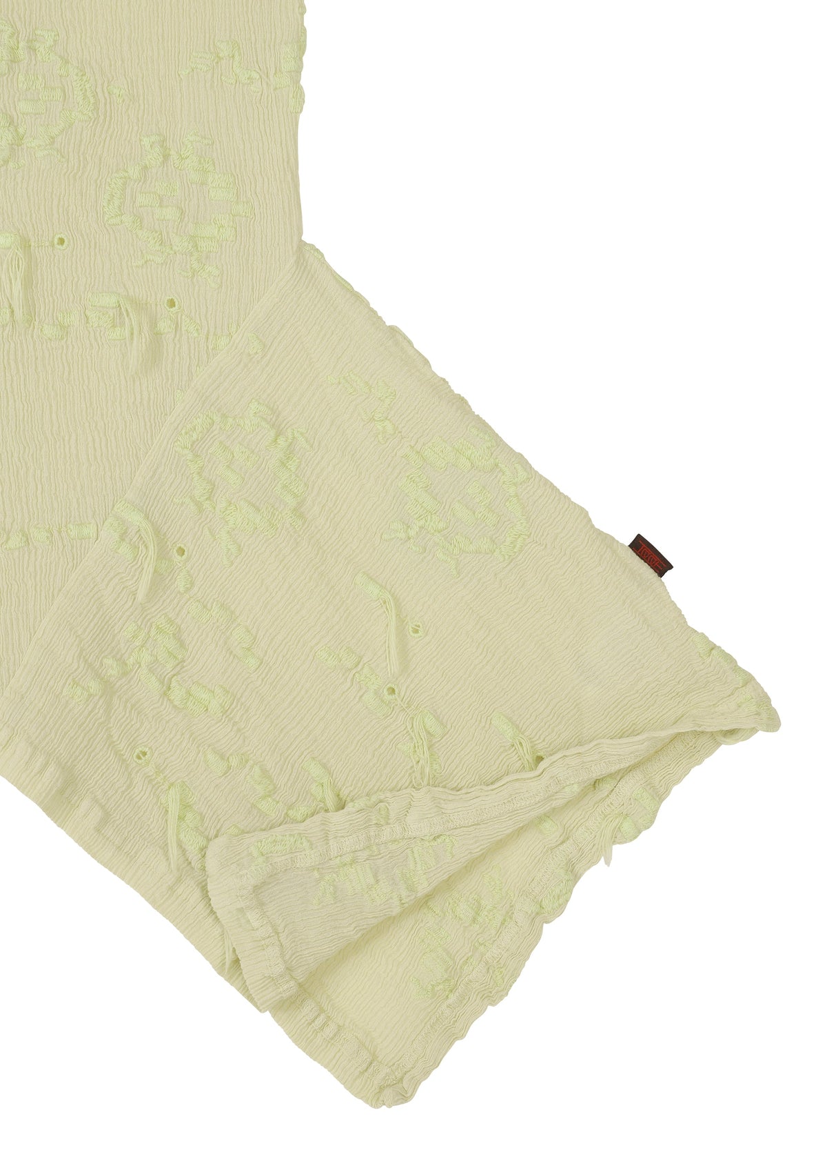 A detail shot of the HAAT KYO CHIJIMI CUT LOOP shirt.