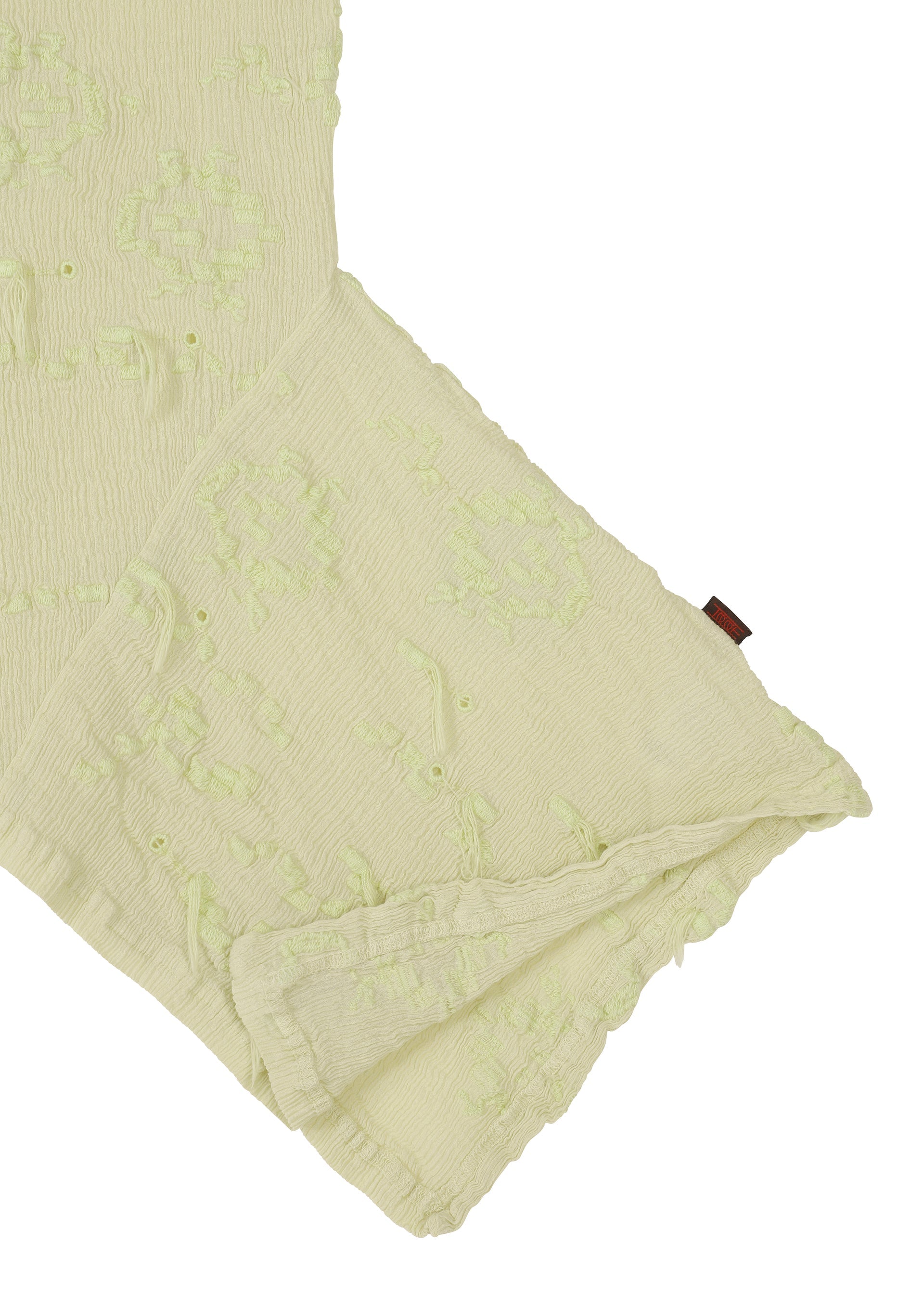 A detail shot of the HAAT KYO CHIJIMI CUT LOOP shirt.