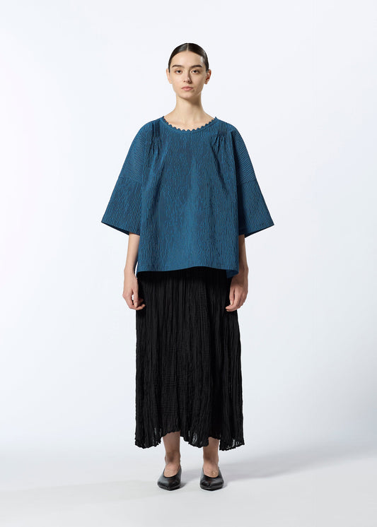 A model wears the HAAT LIGHT WEIGHT shirt.