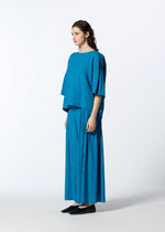 A model wears the HAAT PINTUCKING shirt.