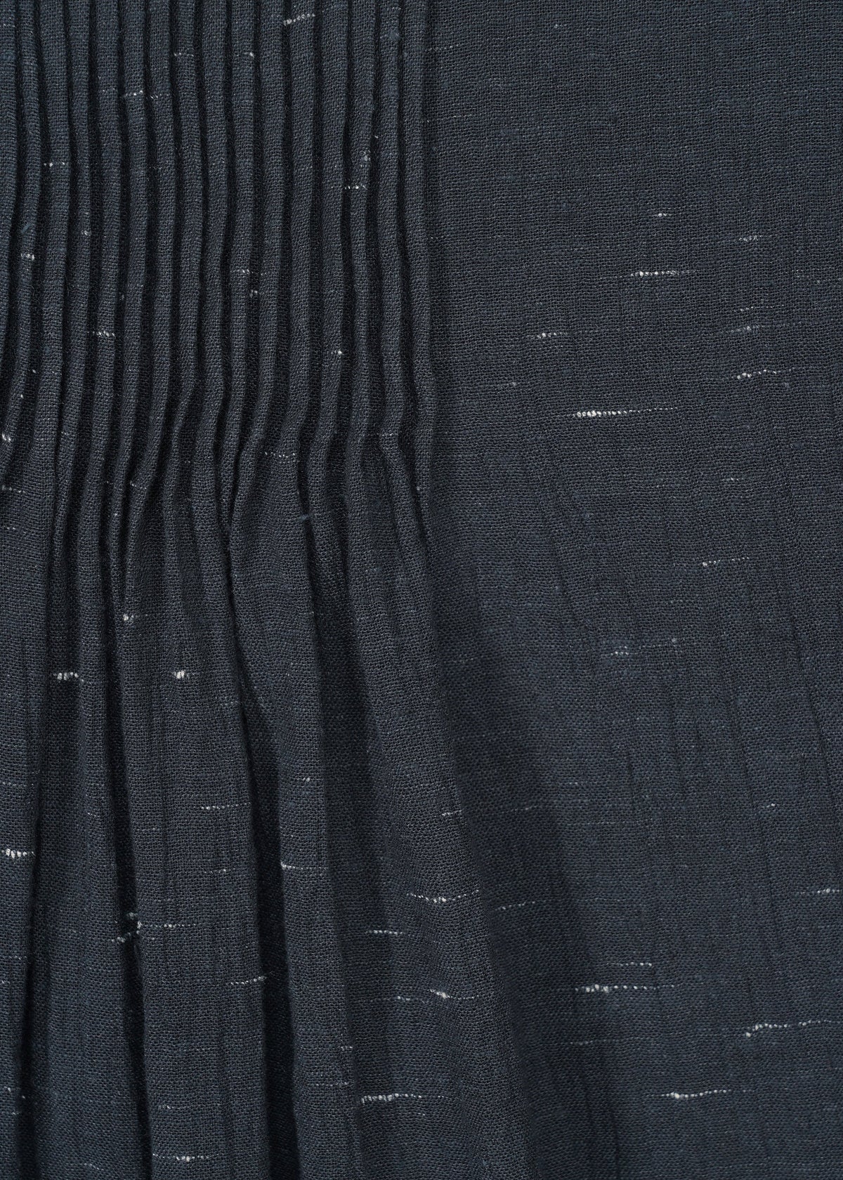 A detail shot of the HAAT PINTUCKING shirt.