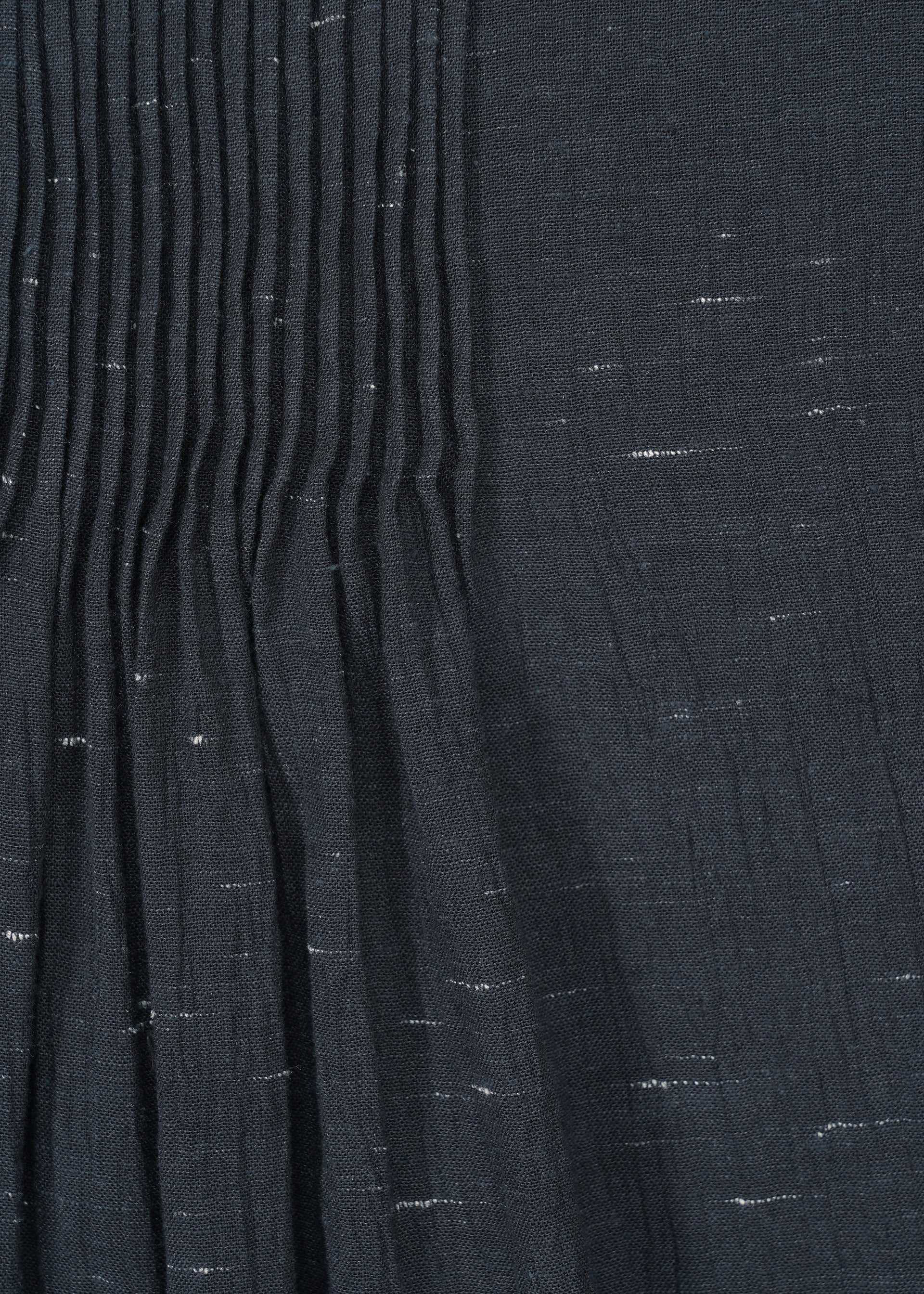 A detail shot of the HAAT PINTUCKING shirt.