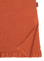 A detail shot of the HAAT KYO CHIJIMI SEPTEMBER shirt.
