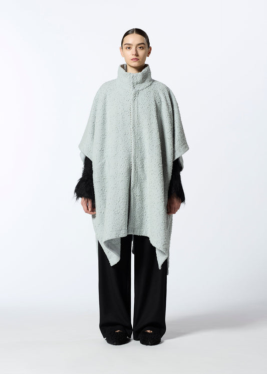 A model wears the HAAT MILLED KNOTS cardigan.