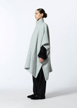 A model wears the HAAT MILLED KNOTS cardigan.