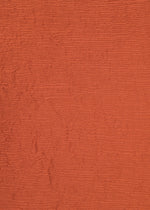 A detail shot of the HAAT KYO CHIJIMI SEPTEMBER tunic.