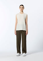 A model wears the HAAT REVERSIBLE BOTTOM trousers.