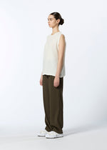 A model wears the HAAT REVERSIBLE BOTTOM trousers.