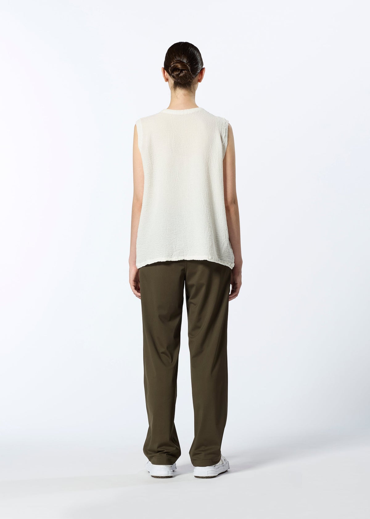 A model wears the HAAT REVERSIBLE BOTTOM trousers.