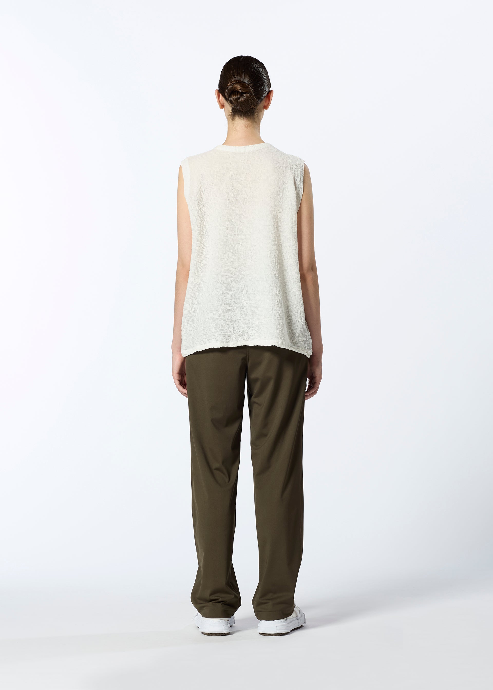 A model wears the HAAT REVERSIBLE BOTTOM trousers.