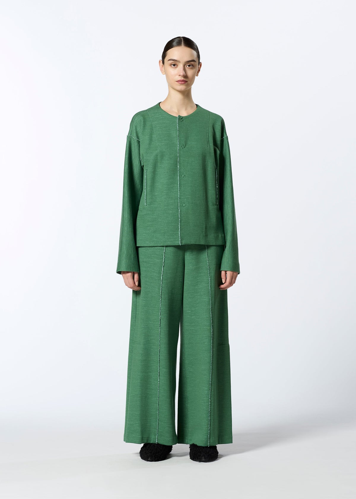 A model wears the HAAT EDGE LINE trousers.