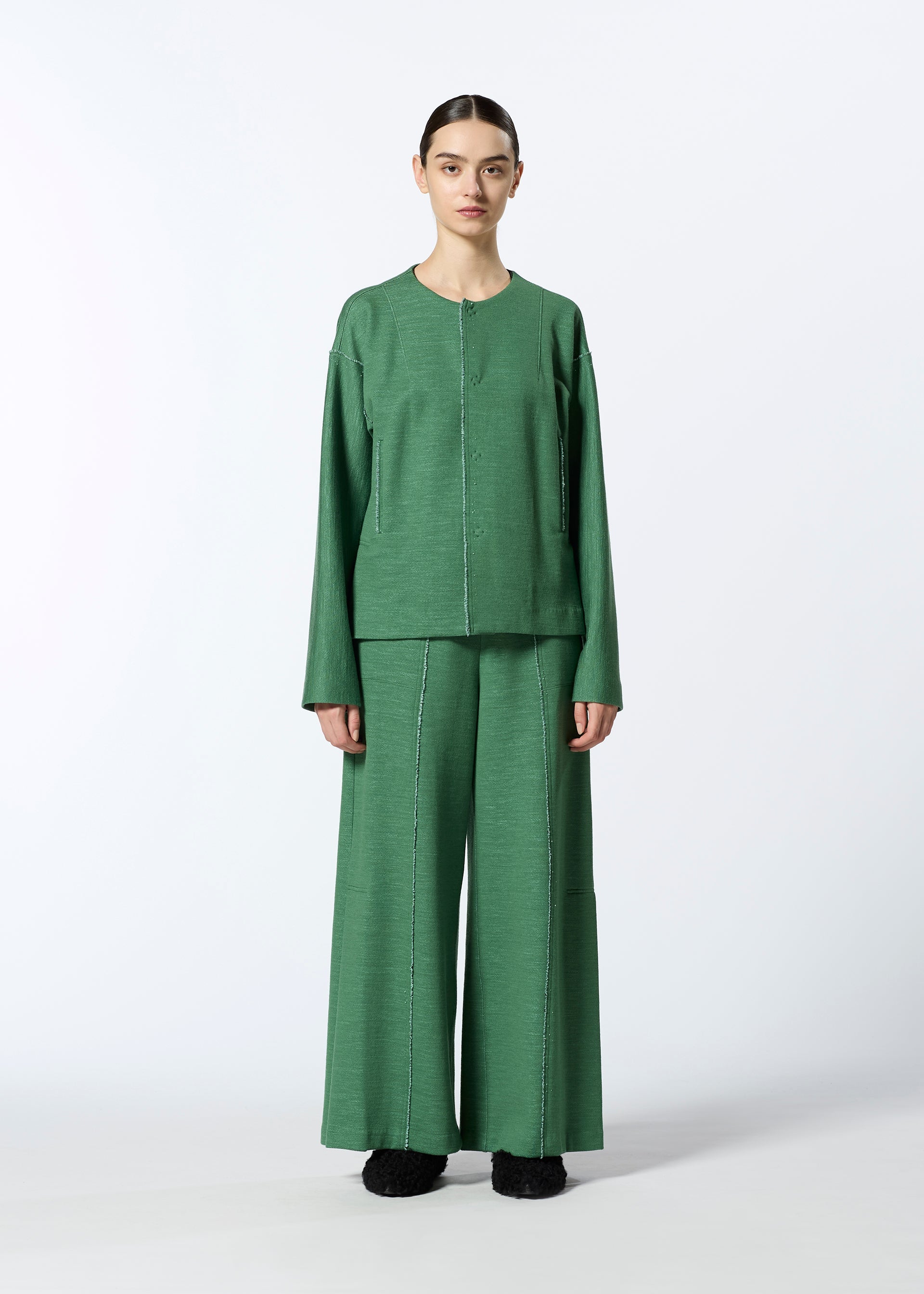 A model wears the HAAT EDGE LINE trousers.