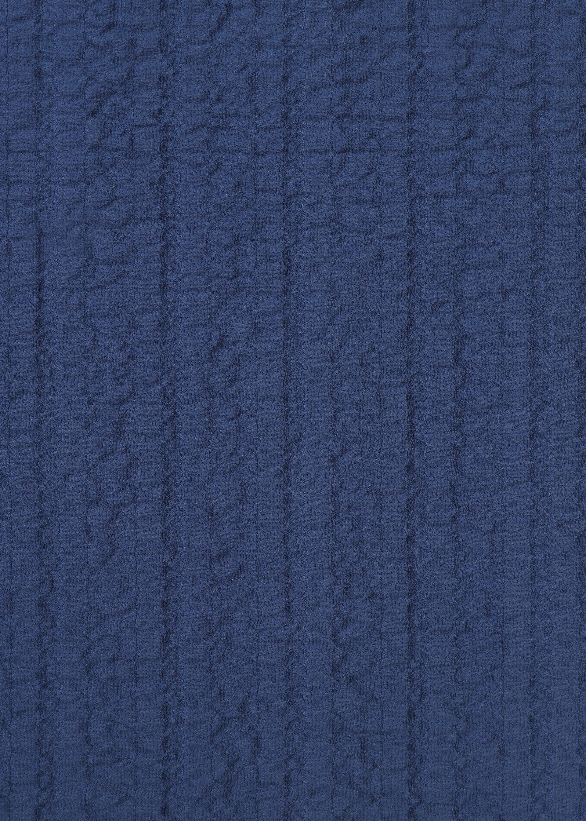 A detail shot of the HAAT RASCHEL ASSEMBLY shirt.