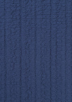 A detail shot of the HAAT RASCHEL ASSEMBLY shirt.