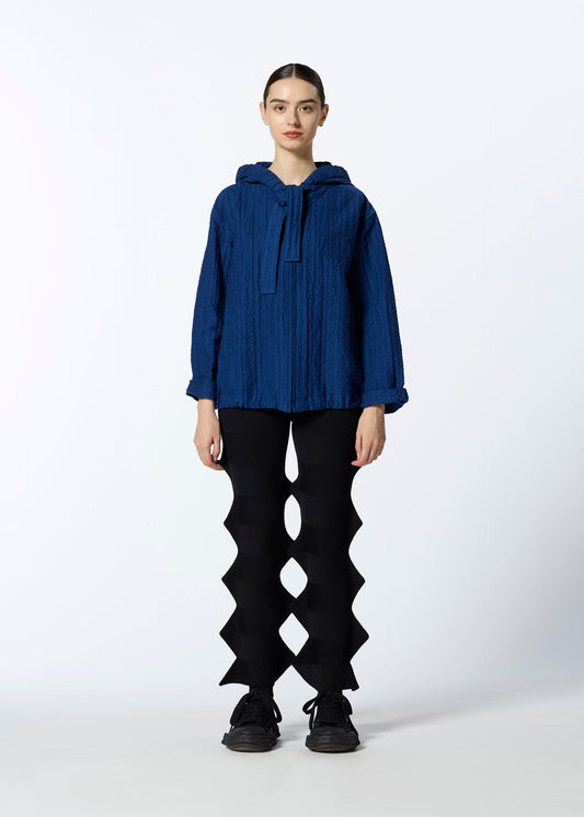 A model wears the HAAT RASCHEL ASSEMBLY cardigan.