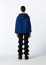 A model wears the HAAT RASCHEL ASSEMBLY cardigan.