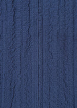 A detail shot of the HAAT RASCHEL ASSEMBLY cardigan.