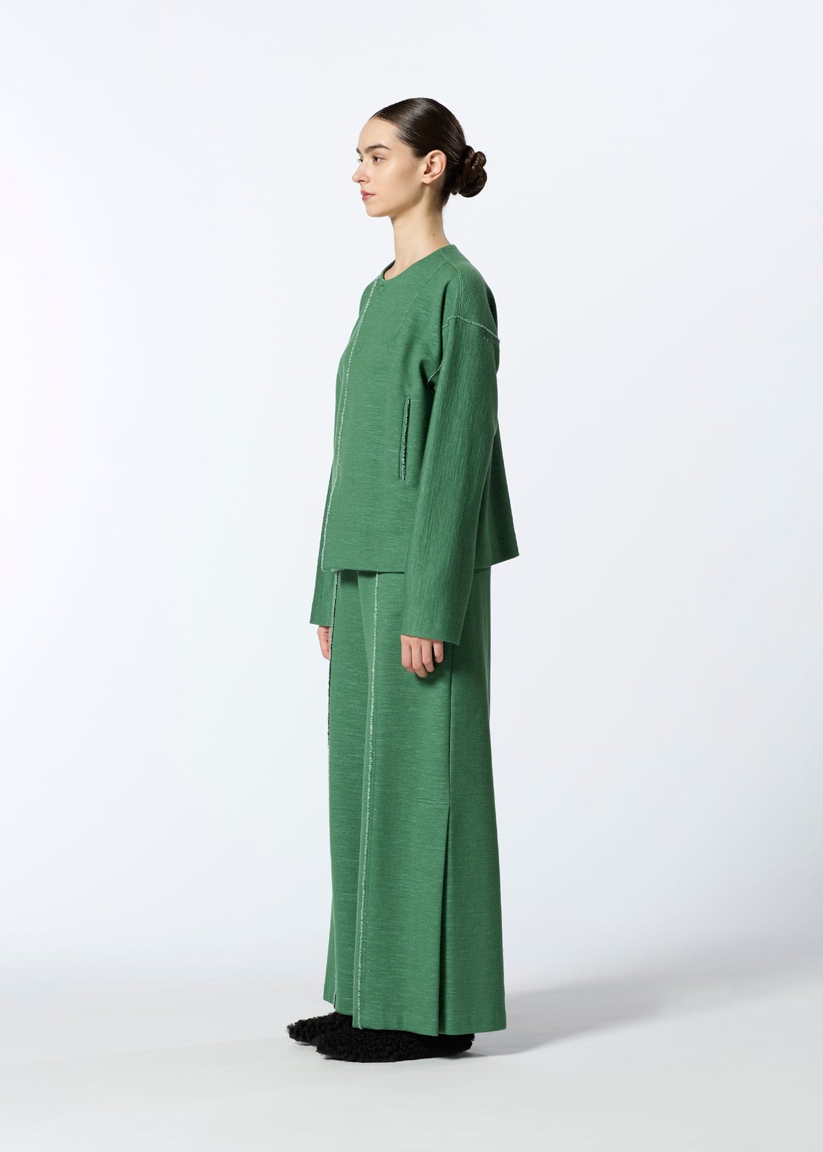 A model wears the HAAT EDGE LINE cardigan.