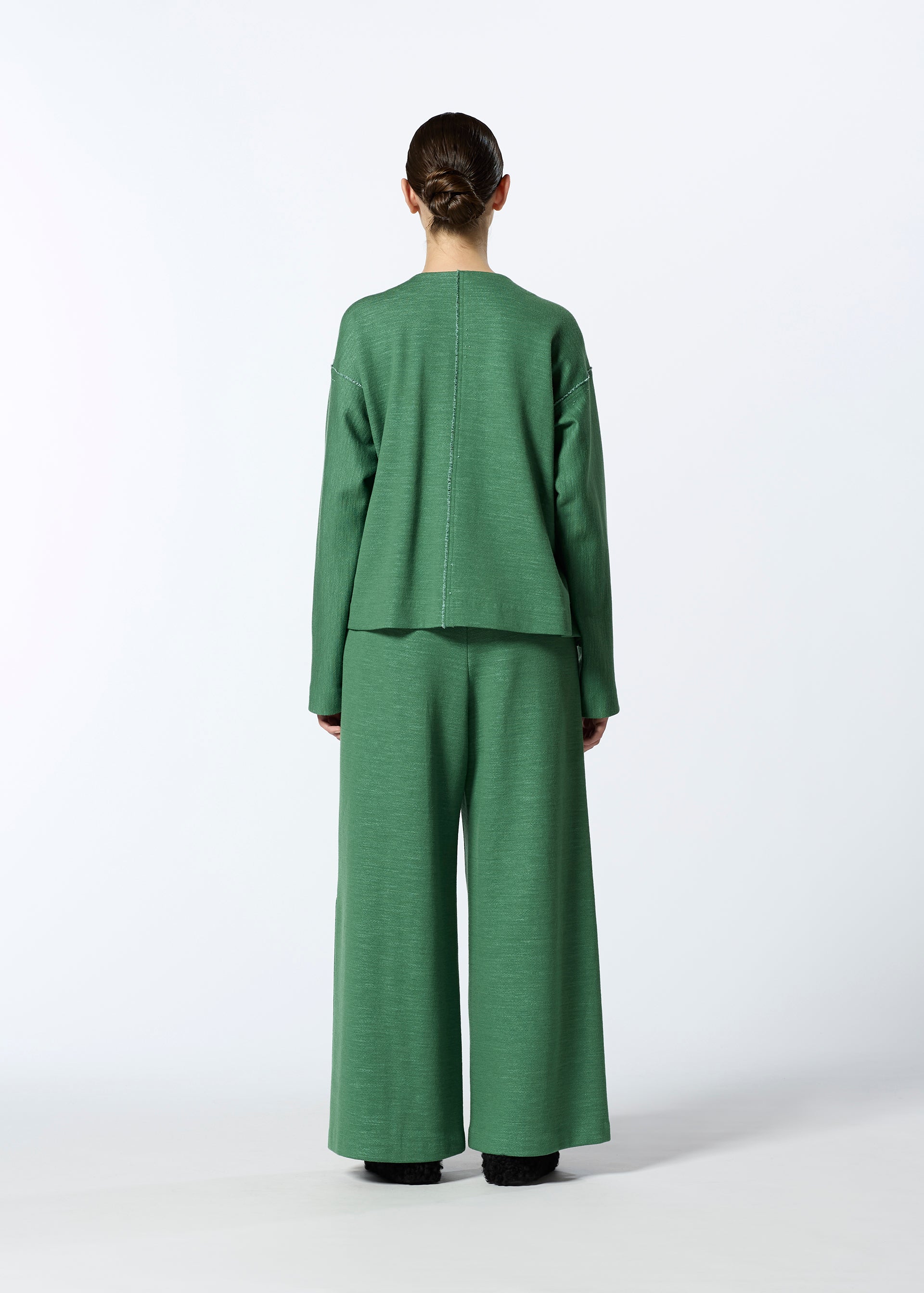 A model wears the HAAT EDGE LINE cardigan.