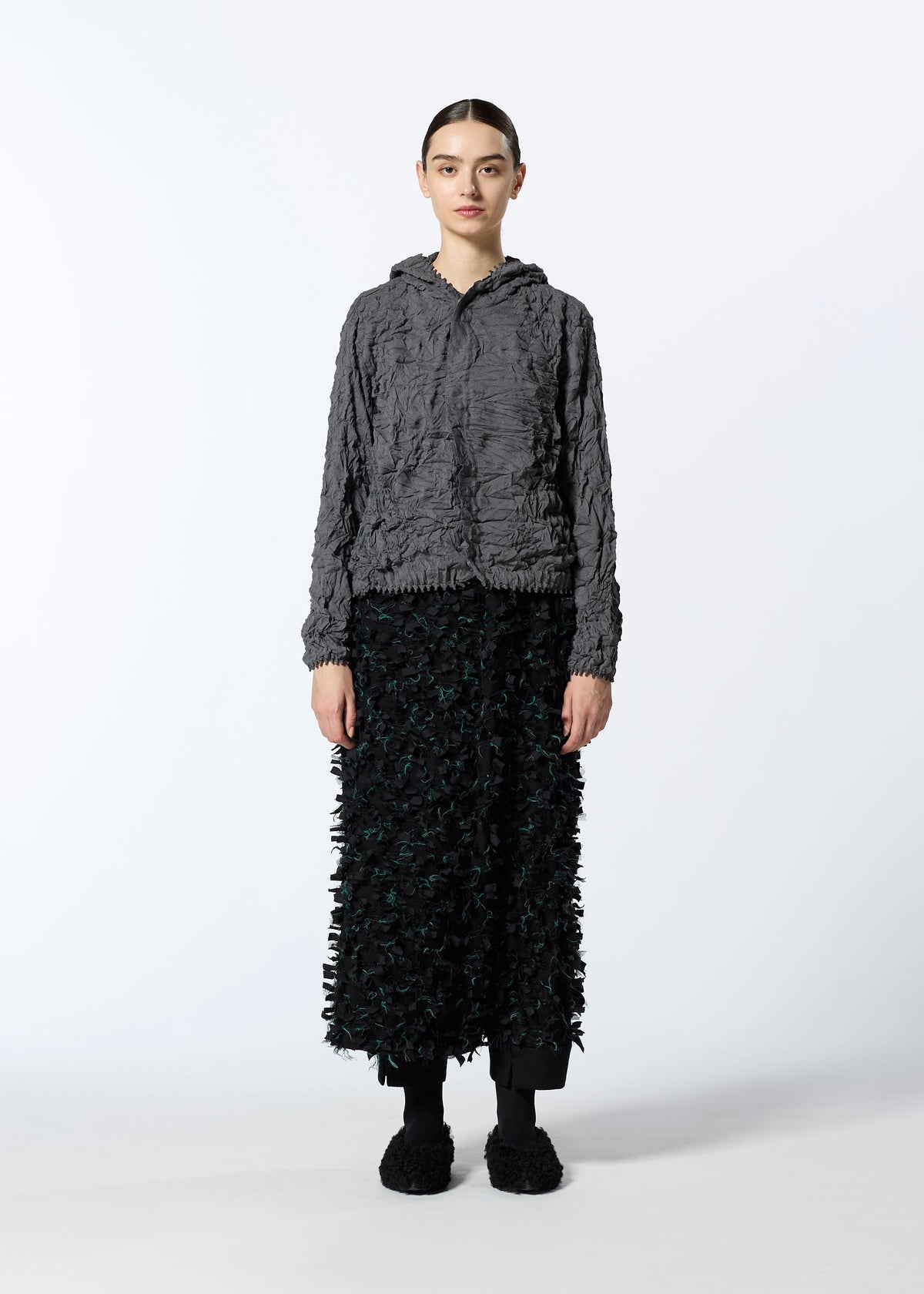 A model wears the HAAT KUMO SHIBORI KNIT clothing.