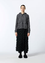 A model wears the HAAT KUMO SHIBORI KNIT clothing.