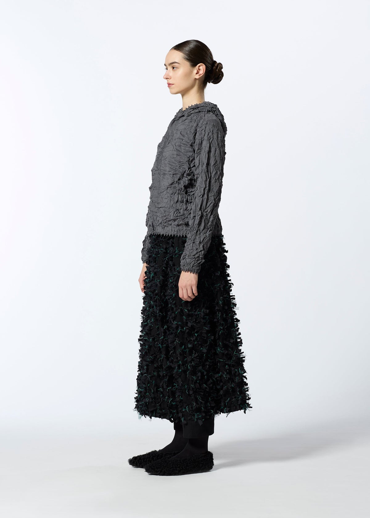A model wears the HAAT KUMO SHIBORI KNIT clothing.