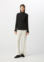 A model wears the HAAT  KYO CHIJIMI BASIC top